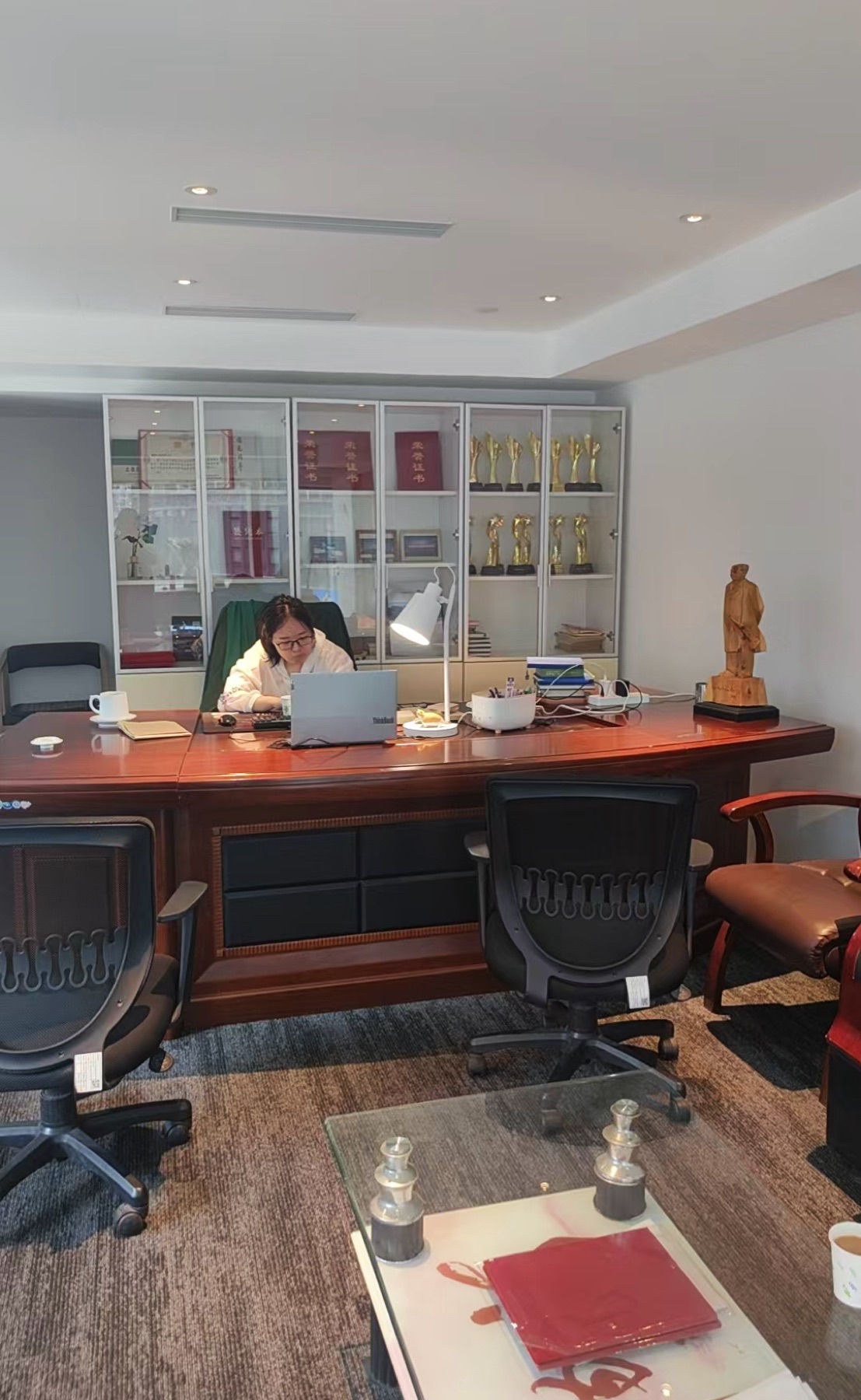 Bowen working on project materials in an office
